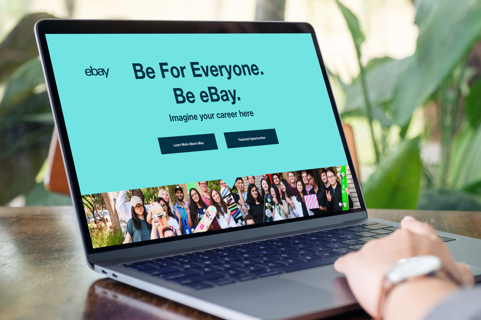 An over-the-shoulder view of a laptop displaying an internal eBay employer branding page designed by the team at Ingenuity Design.