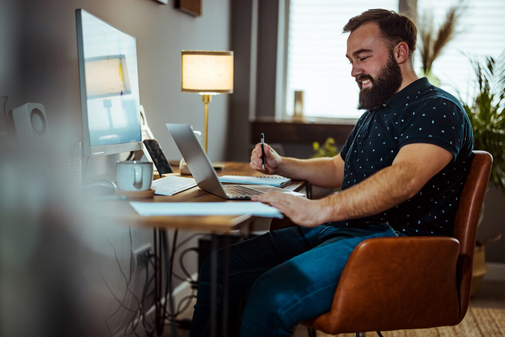 A remote professional working seamlessly using modern digital employee experience platforms deployed by Ingenuity Design.
