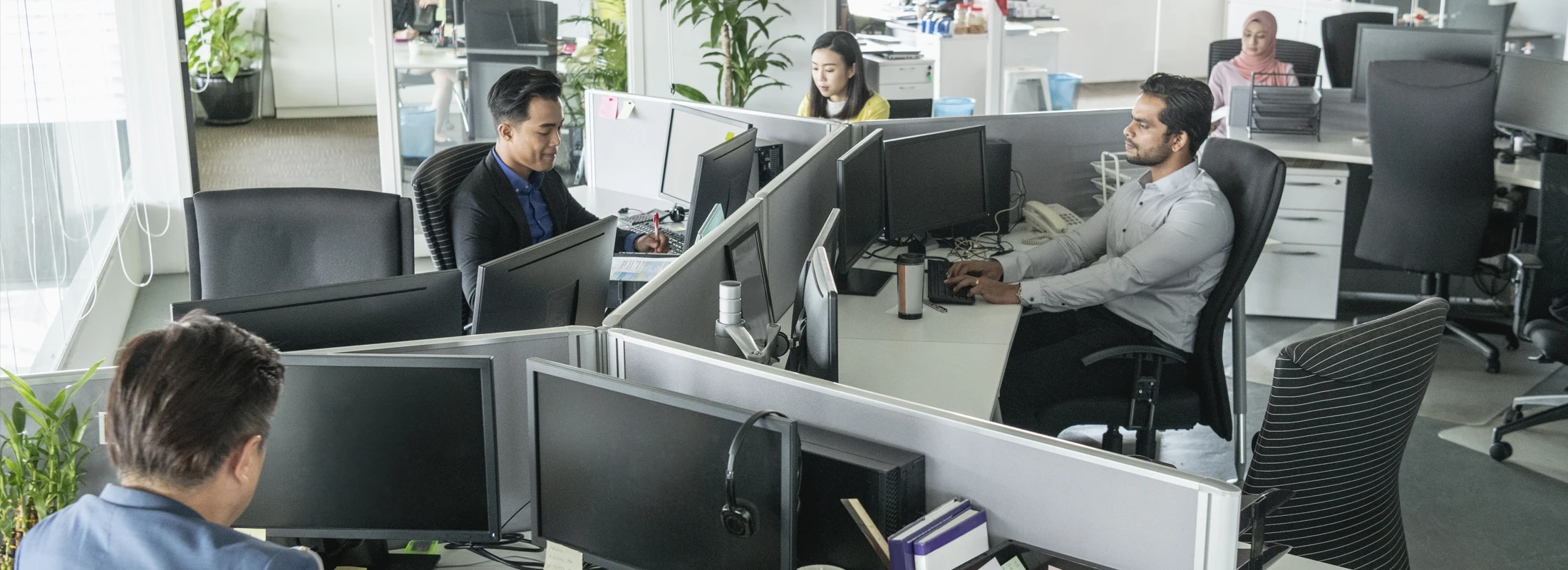 photo of a group of workers in an office